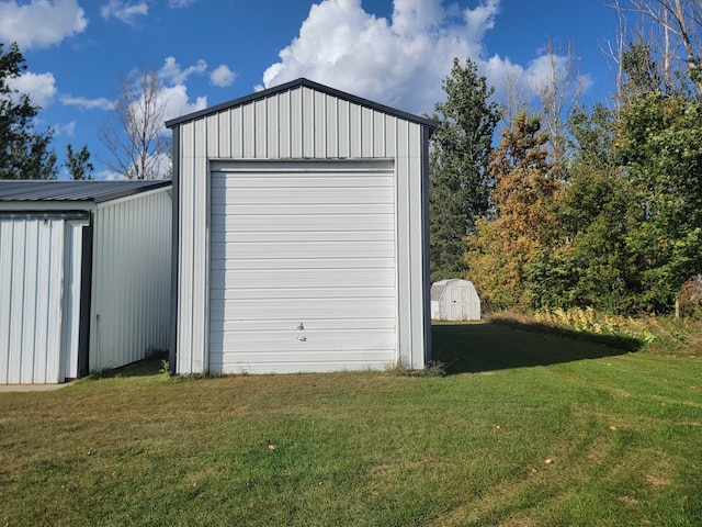 garage featuring a lawn