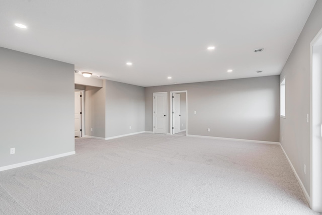 spare room with light colored carpet