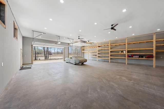 garage featuring baseboards and recessed lighting