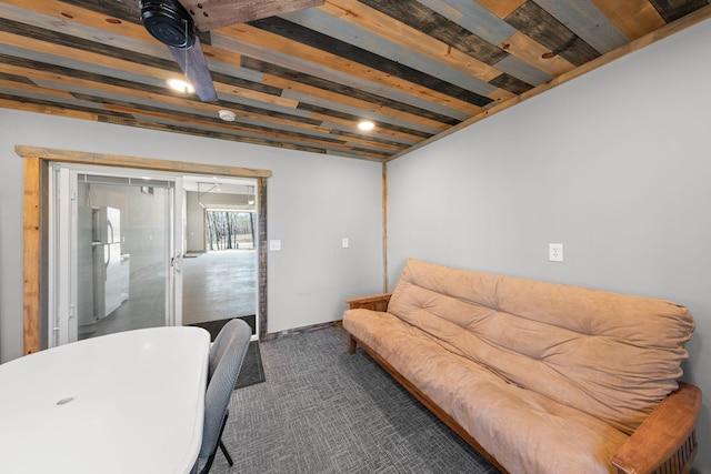 living room featuring dark colored carpet