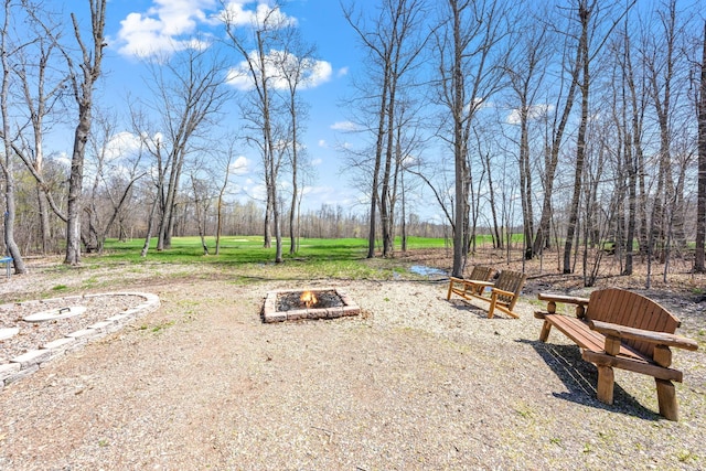 view of home's community with a fire pit