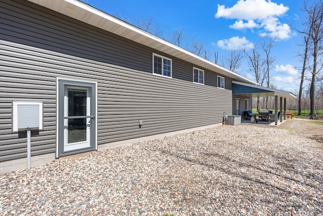 rear view of property featuring a patio area