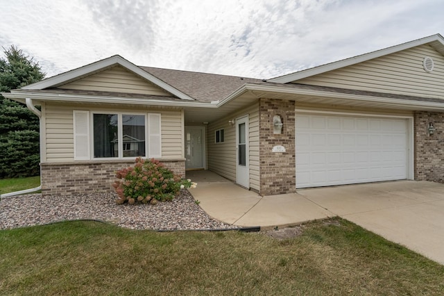 single story home featuring a front lawn and a garage