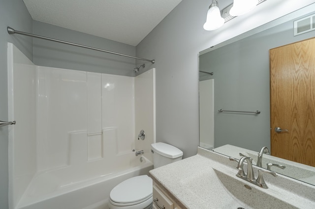 full bathroom featuring a textured ceiling, vanity, toilet, and shower / bath combination