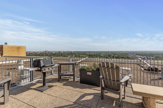 view of patio featuring a grill