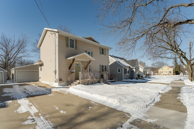 traditional style home with a residential view, a detached garage, and an outdoor structure