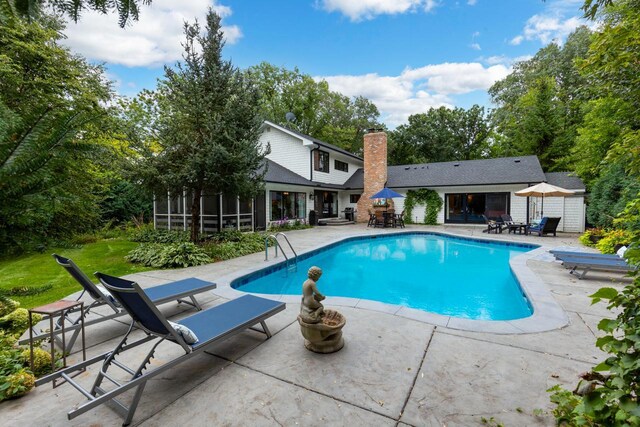 view of swimming pool with a patio