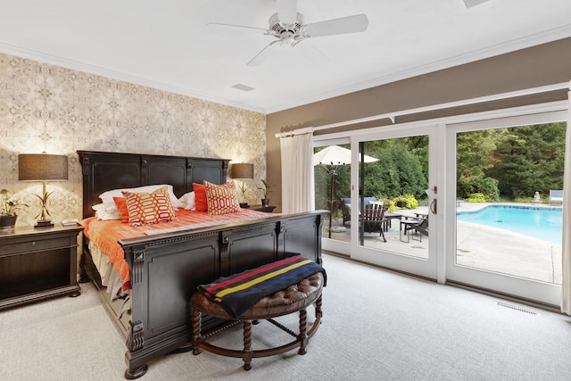 carpeted bedroom featuring ceiling fan, crown molding, and access to exterior