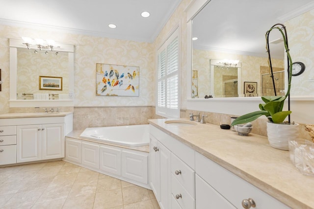 bathroom with vanity, ornamental molding, and independent shower and bath