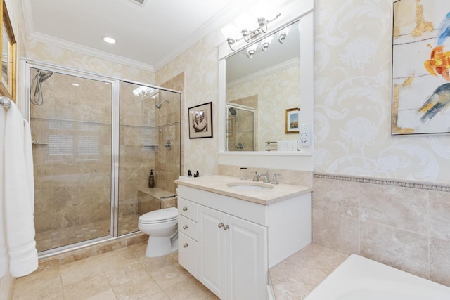 bathroom featuring vanity, toilet, crown molding, and a shower with door