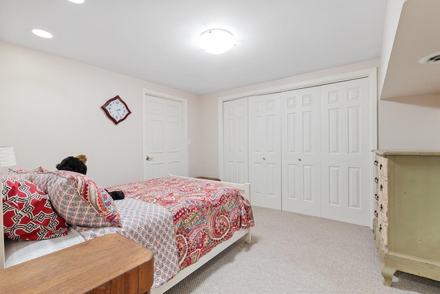 bedroom with a closet and carpet floors