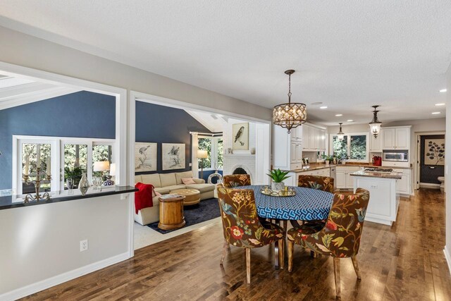 dining area featuring hardwood / wood-style floors and plenty of natural light