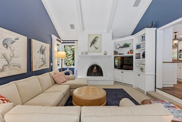 living room featuring crown molding, light hardwood / wood-style flooring, vaulted ceiling with beams, and a fireplace