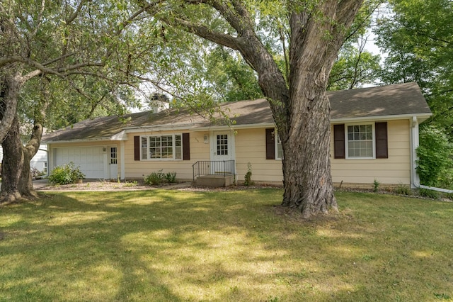 ranch-style home with a front yard and a garage