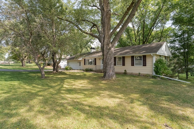 ranch-style home with a front lawn