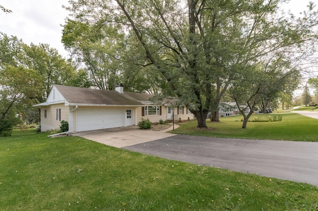 ranch-style home featuring a front lawn and a garage