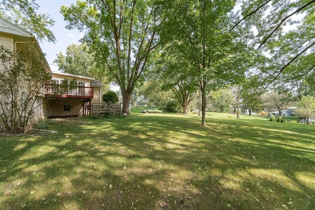 view of yard featuring a wooden deck