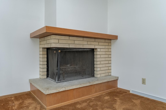 interior details featuring a fireplace and carpet flooring