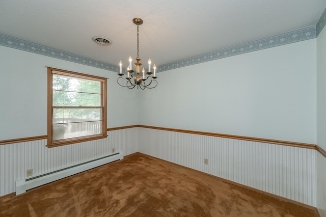 empty room with carpet flooring, a baseboard radiator, a notable chandelier, and a textured ceiling