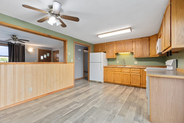2135 24th Ave SW, Pine River Twp, MN 56474 - kitchen featuring white appliances, a sink, light wood finished floors, ceiling fan, and light countertops
