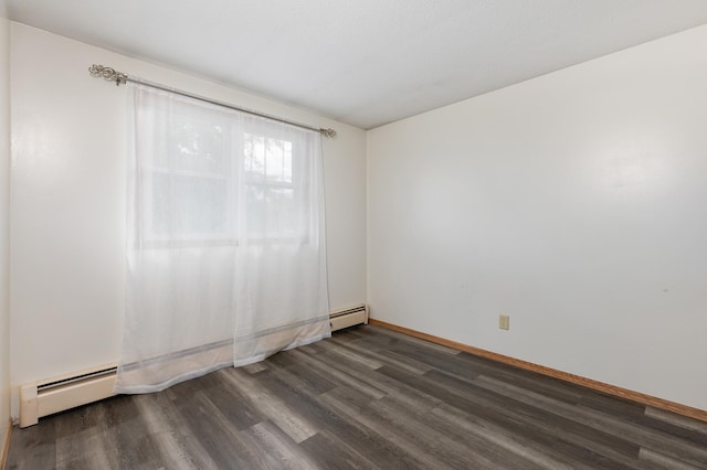 2135 24th Ave SW, Pine River Twp, MN 56474 - spare room featuring baseboard heating, dark wood-style flooring, and baseboards