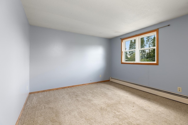 2135 24th Ave SW, Pine River Twp, MN 56474 - spare room featuring carpet, a baseboard radiator, and baseboards