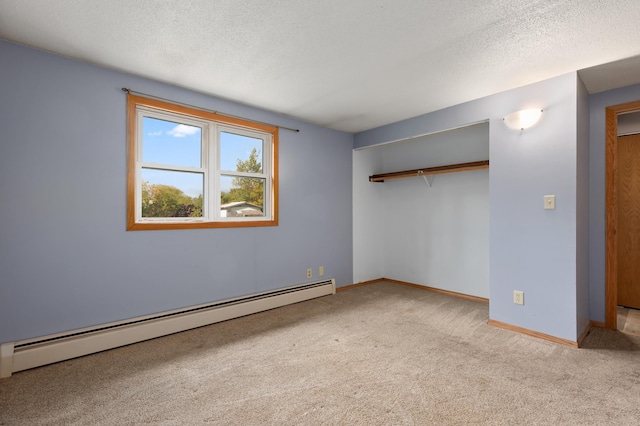 2135 24th Ave SW, Pine River Twp, MN 56474 - unfurnished bedroom featuring a baseboard radiator, carpet, a closet, baseboards, and a textured ceiling