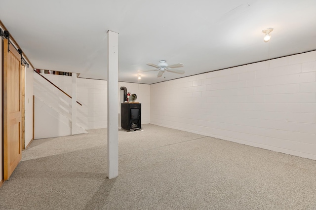 2135 24th Ave SW, Pine River Twp, MN 56474 - finished basement with a barn door, carpet, concrete block wall, and ceiling fan