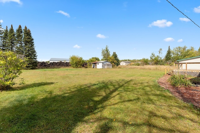 2135 24th Ave SW, Pine River Twp, MN 56474 - view of grassy yard with a wooden deck