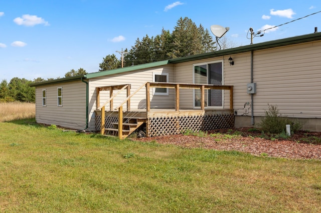2135 24th Ave SW, Pine River Twp, MN 56474 - back of property featuring a deck and a yard