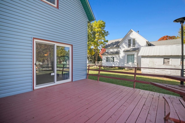 wooden deck with a yard