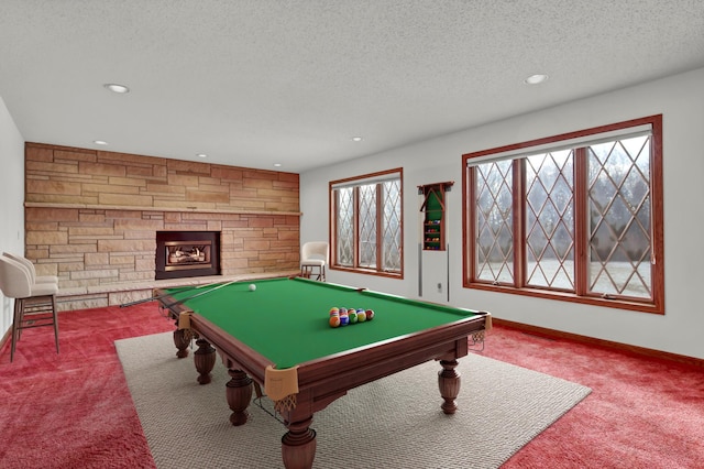 game room featuring carpet, a fireplace, a textured ceiling, and billiards