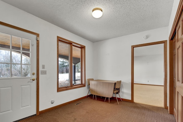 interior space featuring a textured ceiling