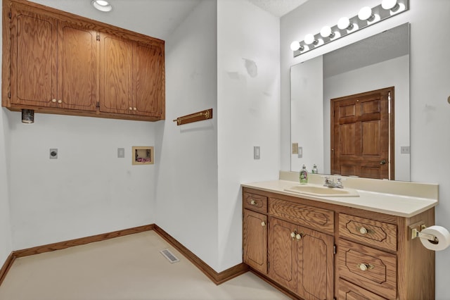 bathroom featuring vanity, baseboards, and visible vents