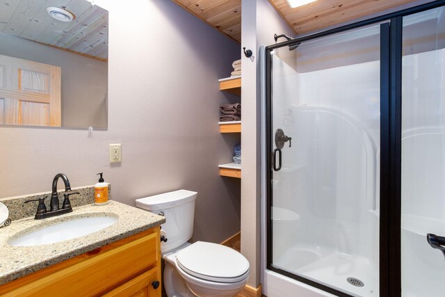 bathroom featuring vanity, wooden ceiling, toilet, and a stall shower