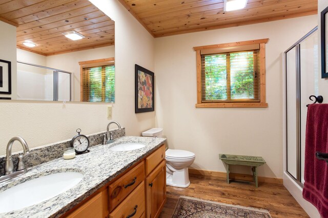 full bath with a shower stall, wooden ceiling, wood finished floors, and a sink