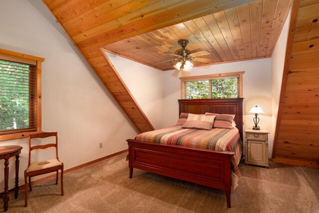 carpeted bedroom with wooden ceiling, a ceiling fan, and baseboards