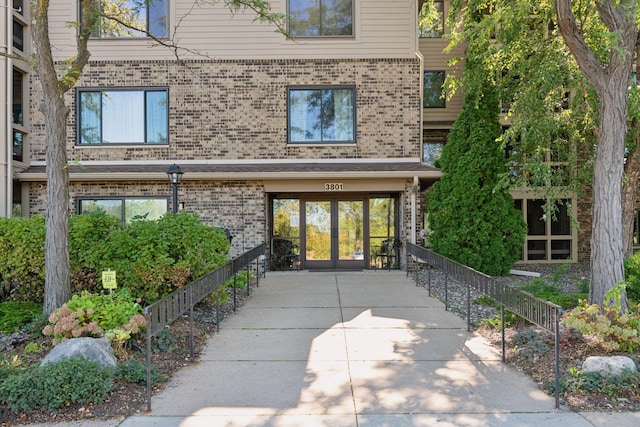 entrance to property with brick siding