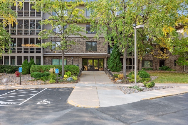 view of property featuring uncovered parking