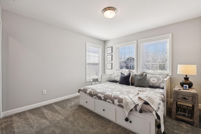 bedroom featuring dark colored carpet