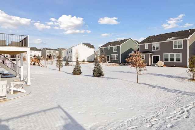 view of yard layered in snow