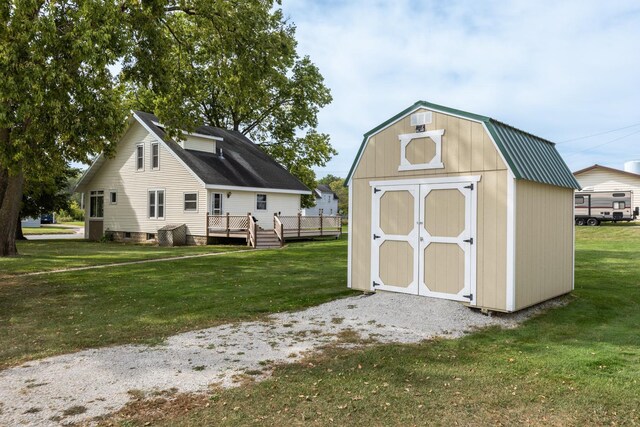 view of outdoor structure with a lawn