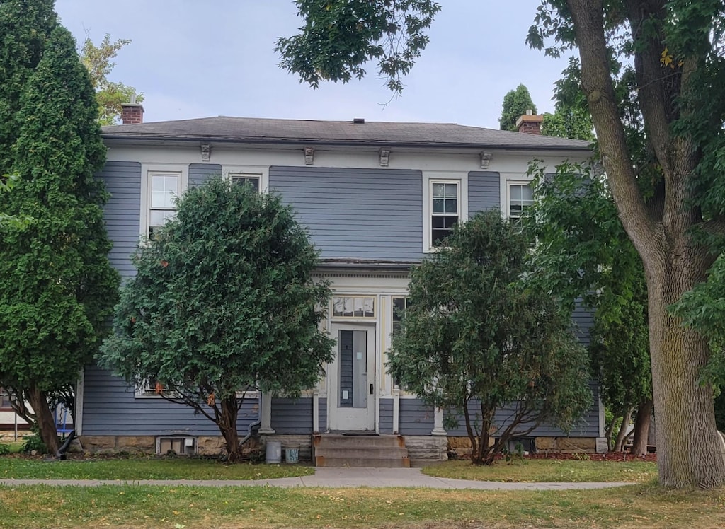 italianate home with a front lawn