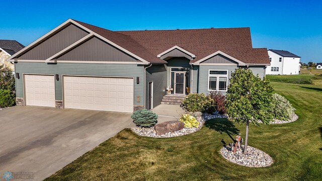 view of front facade with a front lawn and a garage