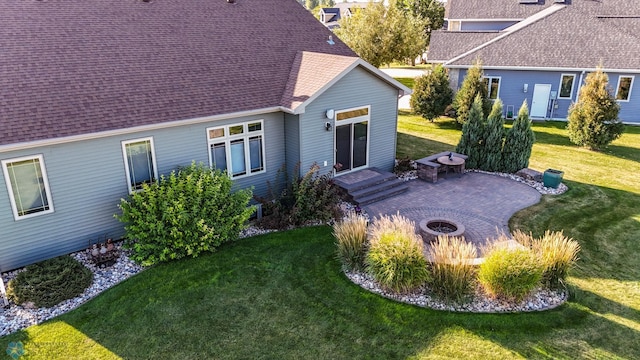 view of yard featuring an outdoor fire pit and a patio area