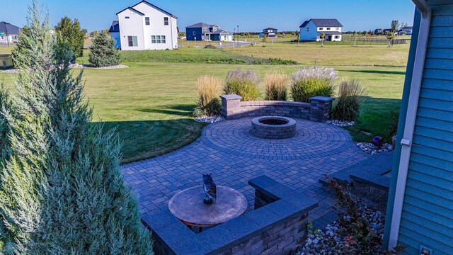 view of yard featuring a patio area and an outdoor fire pit