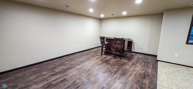 empty room featuring dark hardwood / wood-style floors