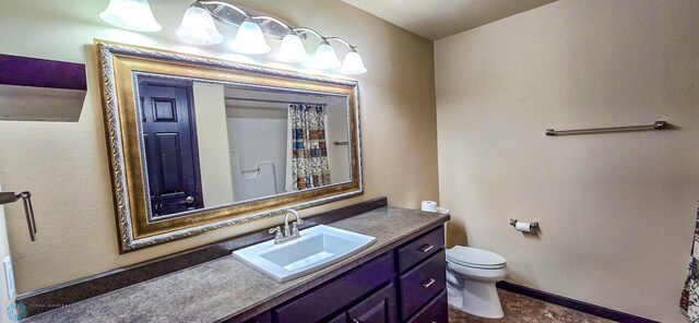 bathroom with vanity, toilet, and a shower with curtain