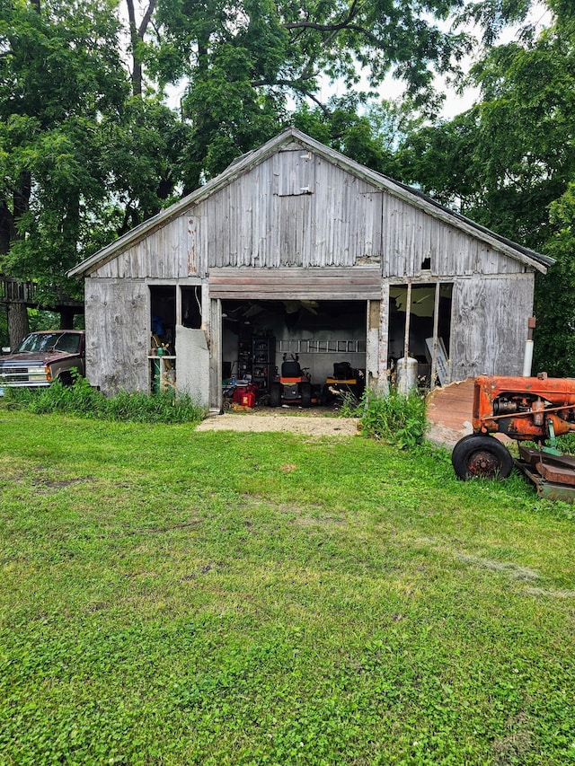 view of outdoor structure with a lawn