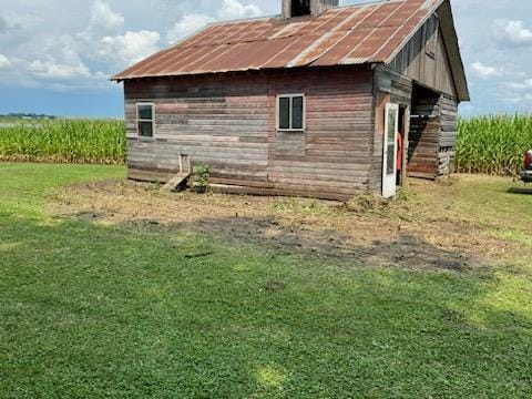 view of home's exterior with a lawn